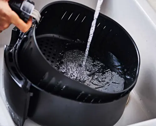 Washing air fryer basket in water
