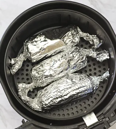 Wrapping the food with foil in air fryer